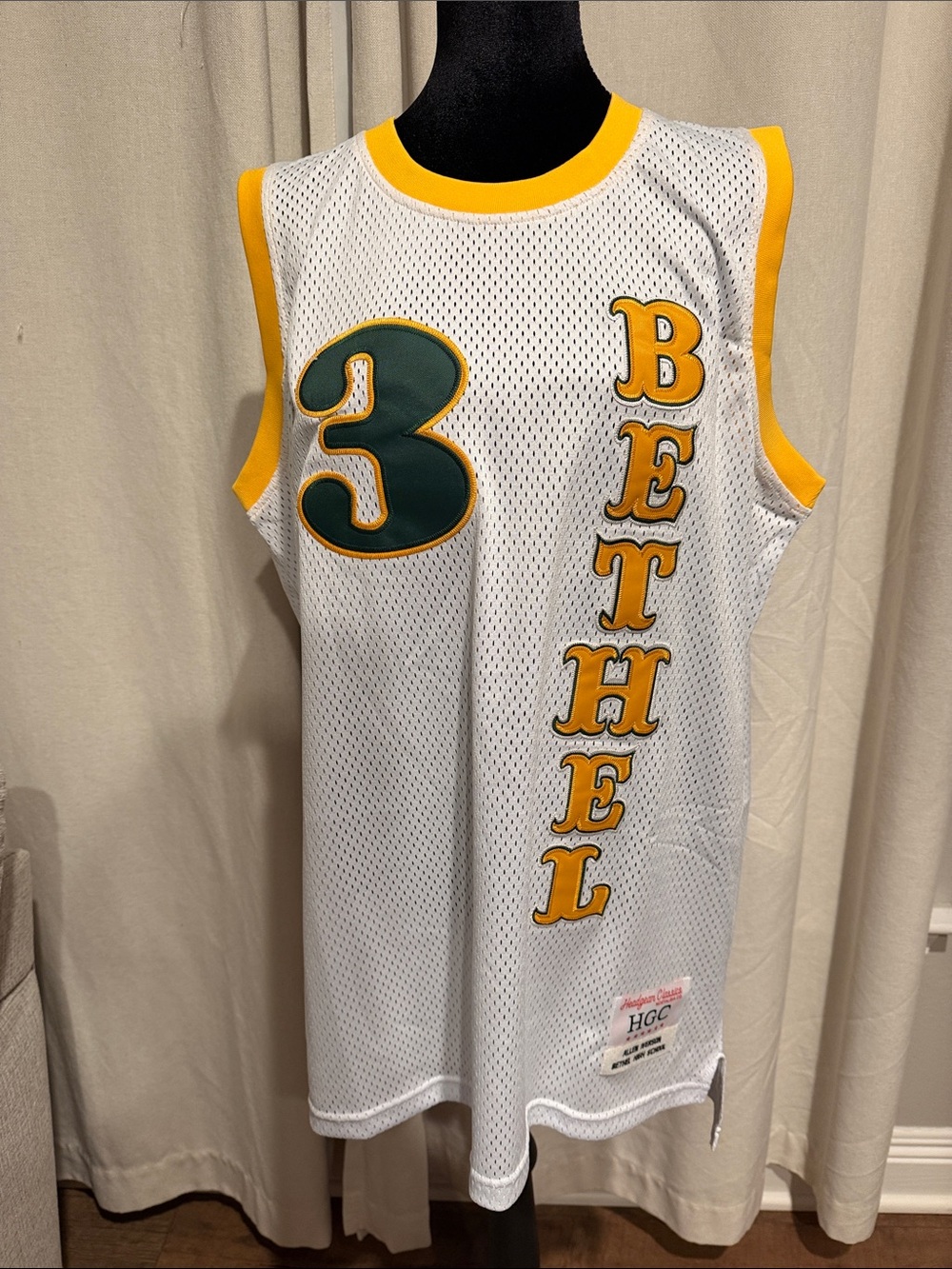 Bethel Mesh Basketball Jersey in White with Yellow Trim and Green Number